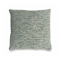 Textured green cushion on a white background