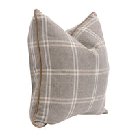 Plaid patterned pillow with a brown border on a white background