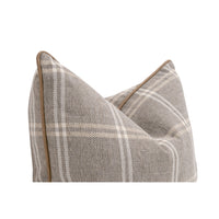 A square throw pillow with a textured gray and beige plaid pattern and tan piping, shown on a plain white background.