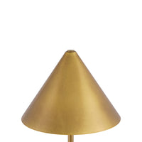A close-up of a table lamp shade in a warm brass or gold finish, shown against a plain white background.