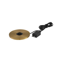 Gold table lamp base with black center and power adapter on a white background