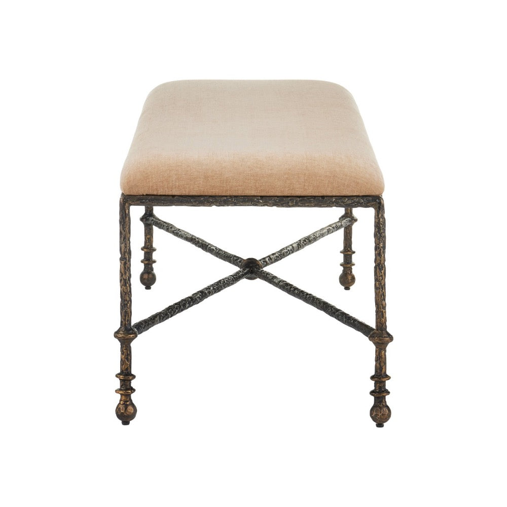 Stool showing a tan woven fabric cushion on a distressed dark bronze metal frame with a textured, branch-like finish.