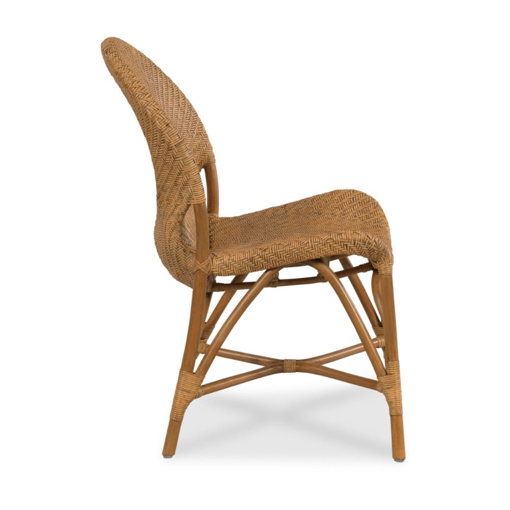 A classic outdoor dining chair made of woven natural rattan on a light brown bamboo frame, shown from a three-quarters angle against a white background.