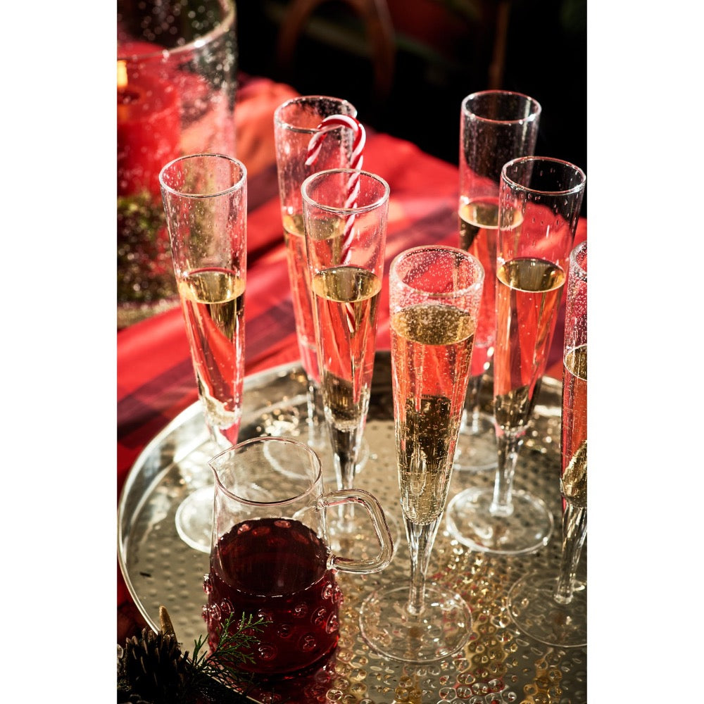 Set  of 6 bubbled glass clear champagne flute on a gold platter