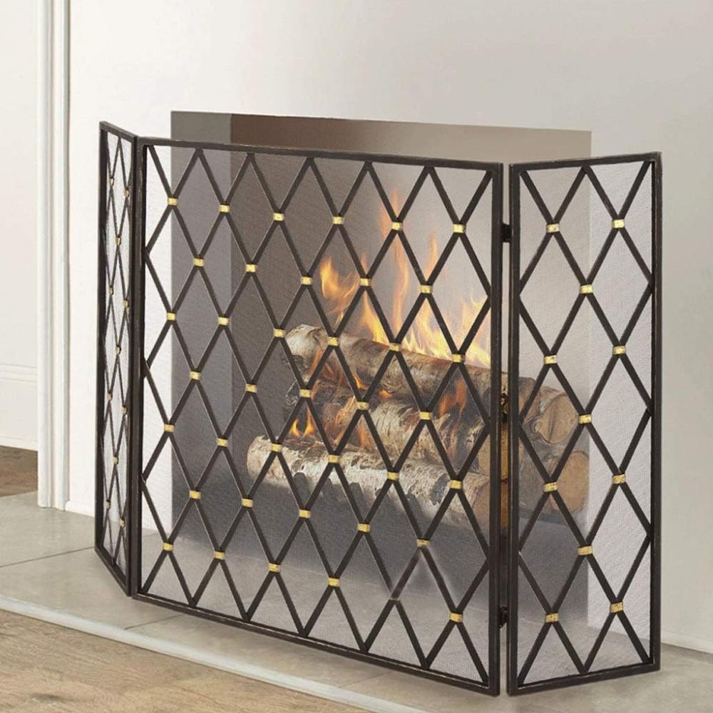Decorative fireplace screen with fire burning inside