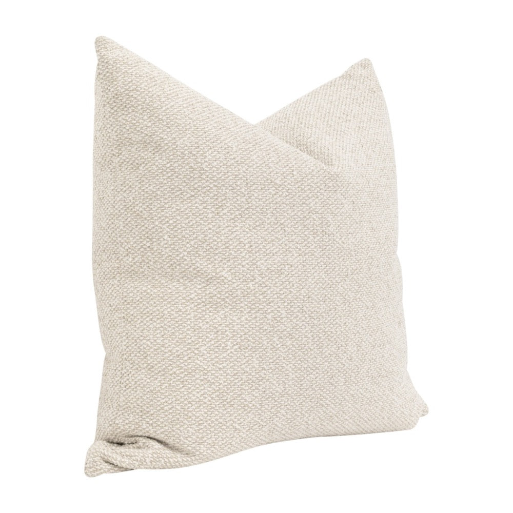 Textured beige pillow on a white background