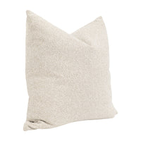 Textured beige pillow on a white background