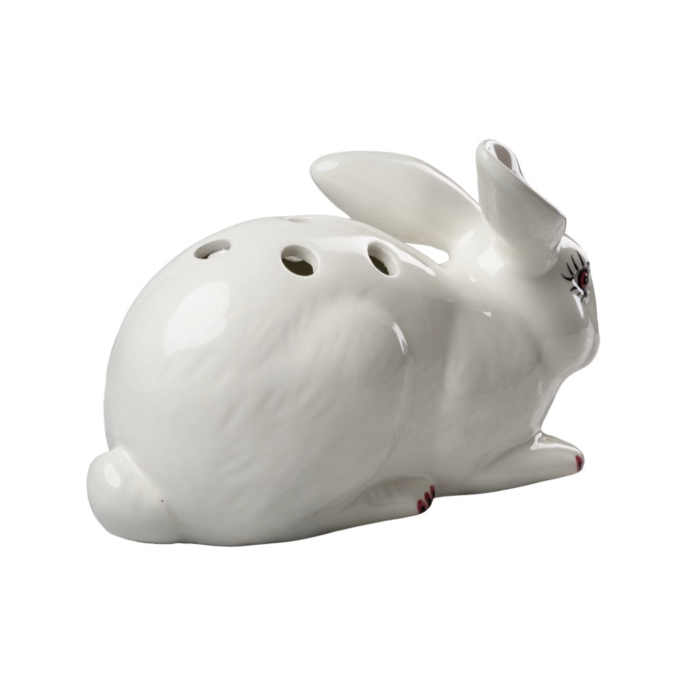 White ceramic rabbit-shaped decorative item on a white background
