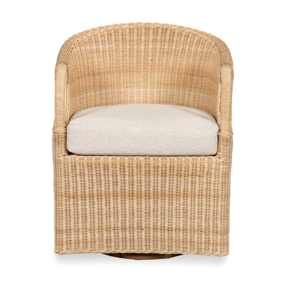A natural woven rattan swivel armchair with a light beige seat cushion, shown against a plain white background.