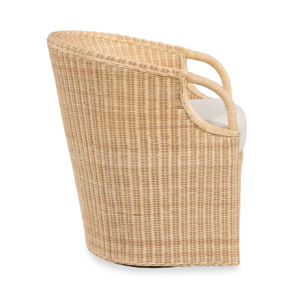 A natural woven rattan storage basket with integrated handles and a light gray fabric lining, shown from a three-quarters angle on a white background.