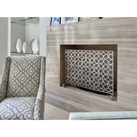 antique silver fire screen in fire place patterned chair