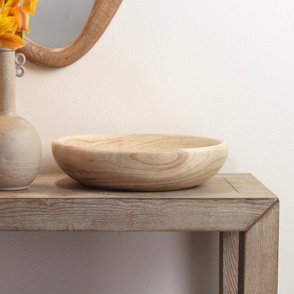 Jamie Young Laurel Small Paulownia Wood Bowl on rustic table with carved vase and mirror, showcasing organic beauty.
