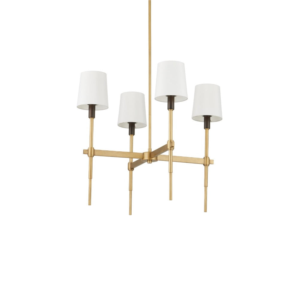 A modern 4-light chandelier with a brushed gold metal frame, four tapered white fabric shades, and dark metal socket collars, shown against a plain white background.