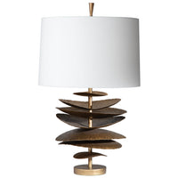 Table lamp with a unique spiral design base and white shade on a white background