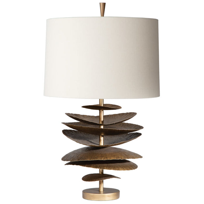 Decorative table lamp with tiered wooden base and white shade on a white background