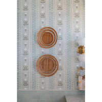 Decorative wall with wicker baskets and floral pattern