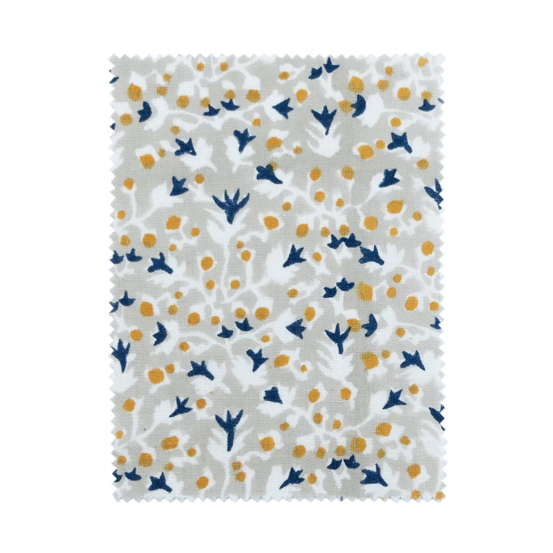 Anna Blue + Dijon block print fabric sample in floral blue and orange on beige; pinked edges. Allem Studio.