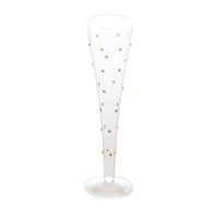 A clear glass champagne flute decorated with small metallic gold and silver rhinestone accents, set against a plain white background.