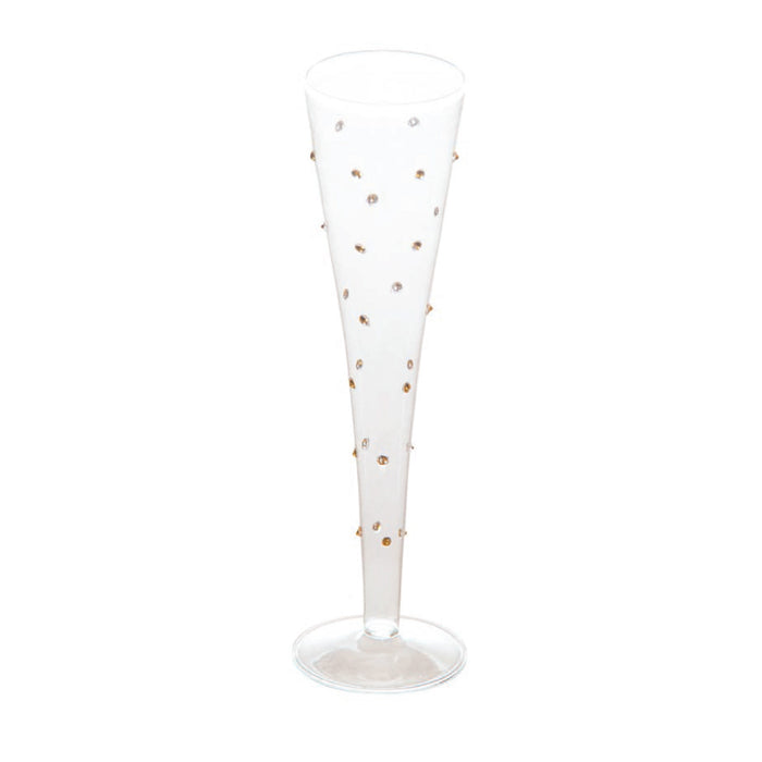 A clear glass champagne flute decorated with small metallic gold and silver rhinestone accents, set against a plain white background.