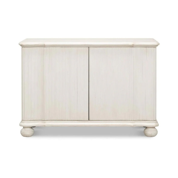Astrid Entrance Commode Antique White Cabinet by Sarreid, Ltd. features fluted details and round feet in reclaimed pine.