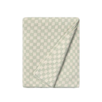 A folded checkered blanket or throw in pale sage green and cream, shown on a plain white background.