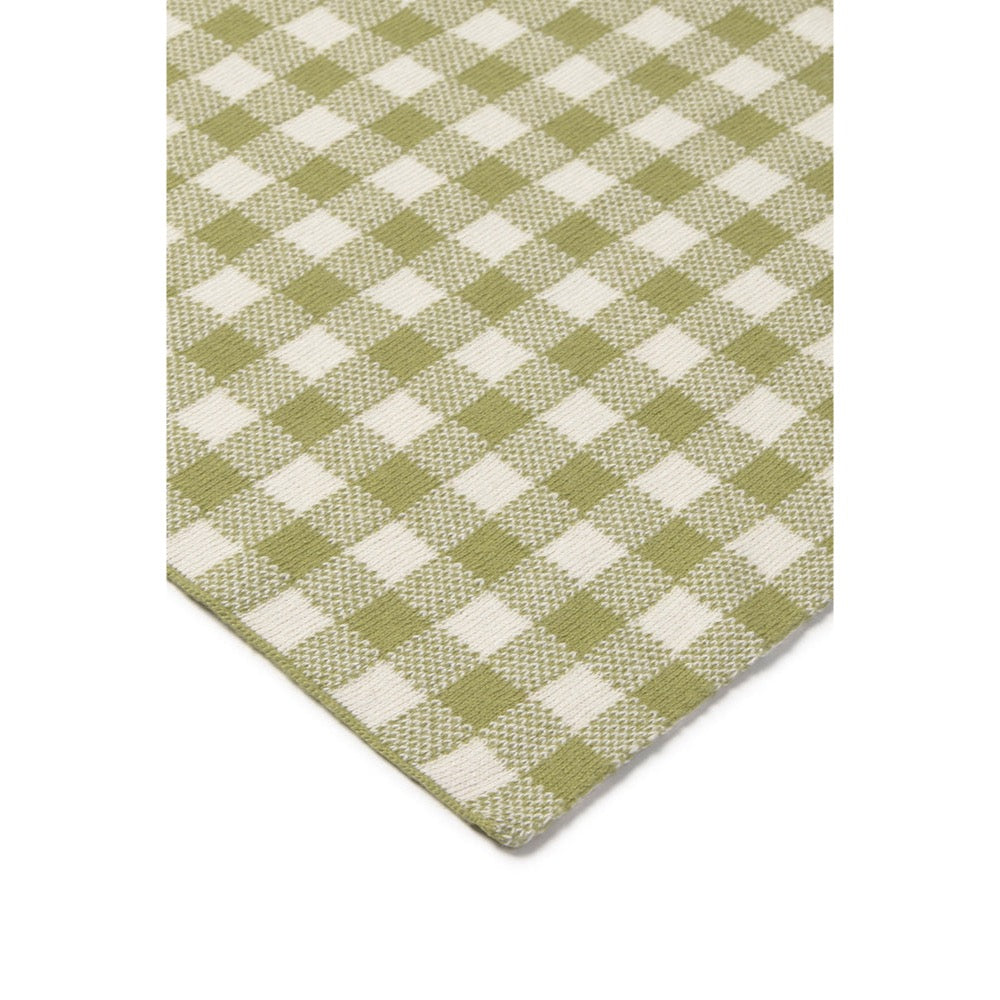 Green and white checkered pattern on a beige background