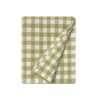 A folded woven throw blanket with a green and off-white gingham check pattern, shown on a solid white background.