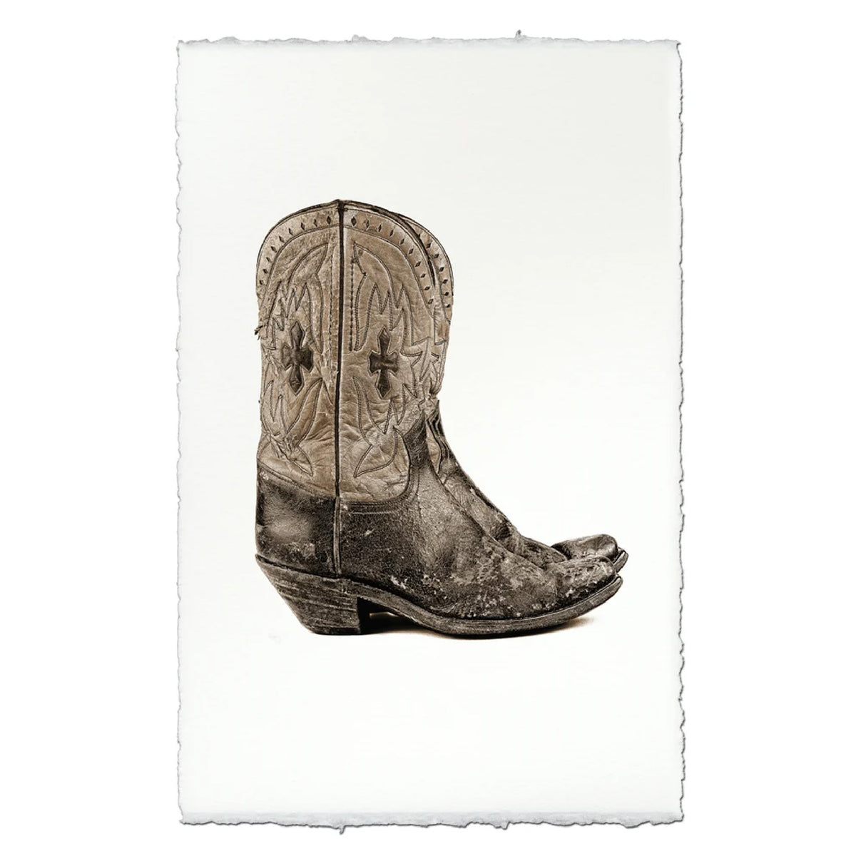 Art print featuring a sepia-toned photograph of a distressed western cowboy boot, displayed on a white sheet of paper with torn edges against a white background.