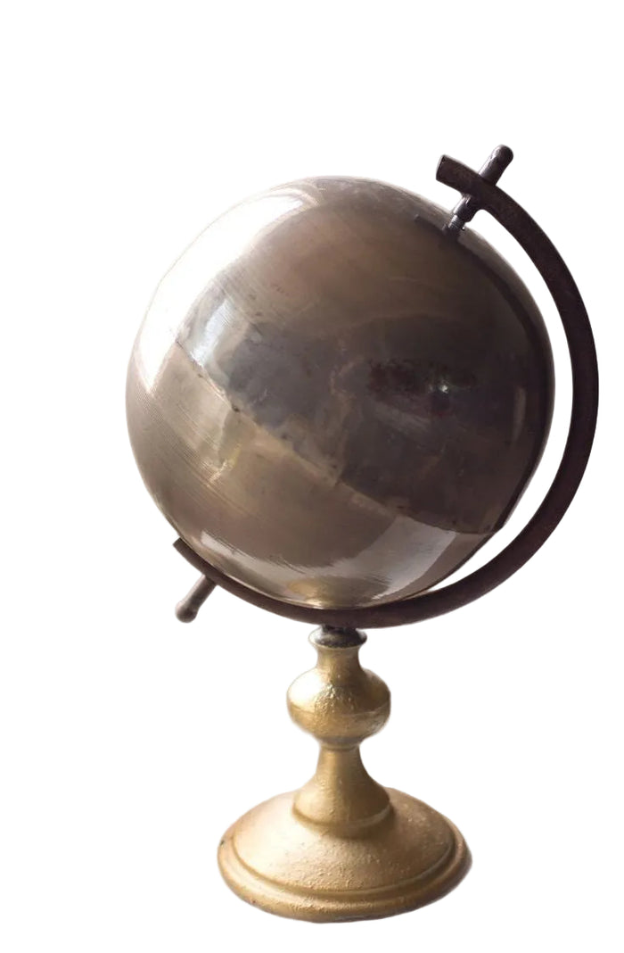 Decorative globe on a stand with a white background