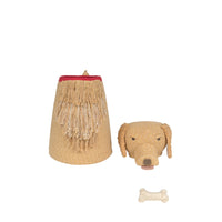 A dog-themed basket featuring a woven basket with a red fabric trim and fringe, a matching woven dog head plush top, and a small woven bone toy, all on a plain white background.