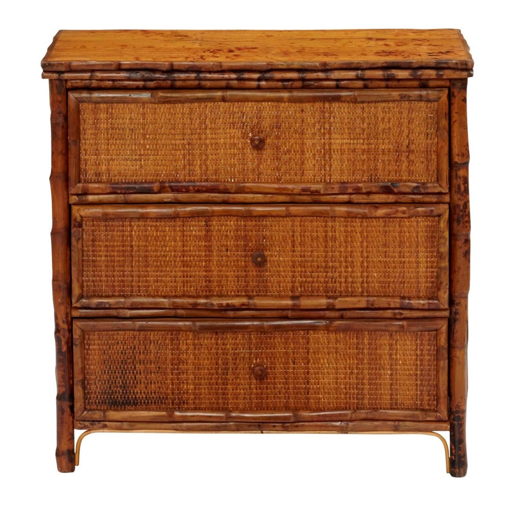 Kenian's Tortoise Shell Bamboo + Rattan Bedside Chest is a vintage wood dresser with three drawers and rustic design.