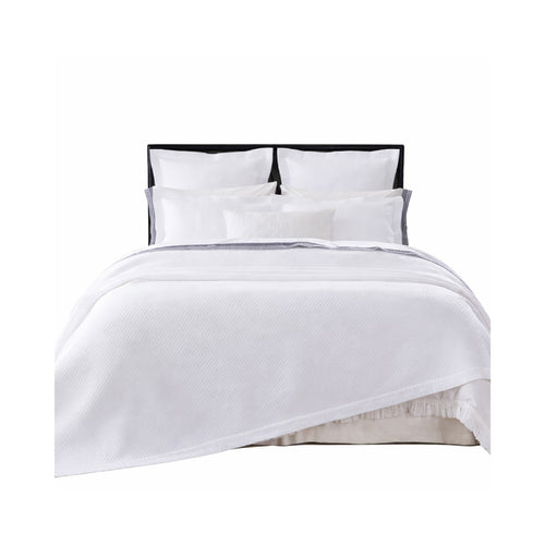 The Hamilton White Matelasse Coverlet + Shams Collection by Orchids Lux Home features white diamond quilting and four pillows.