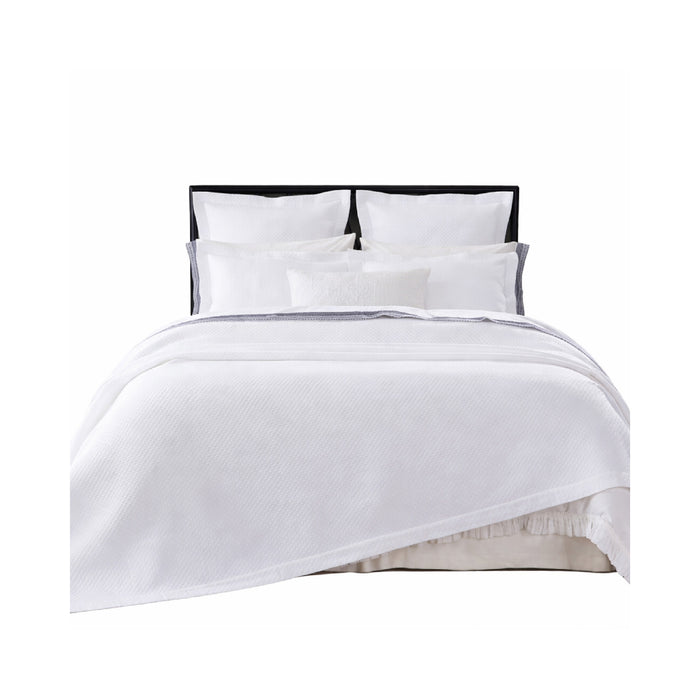 The Hamilton White Matelasse Coverlet + Shams Collection by Orchids Lux Home features white diamond quilting and four pillows.