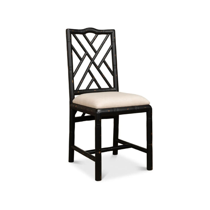Brighton Bamboo Black Side Chairs (set of 2) by Sarreid, Ltd. feature geometric backs and light beige cushions.