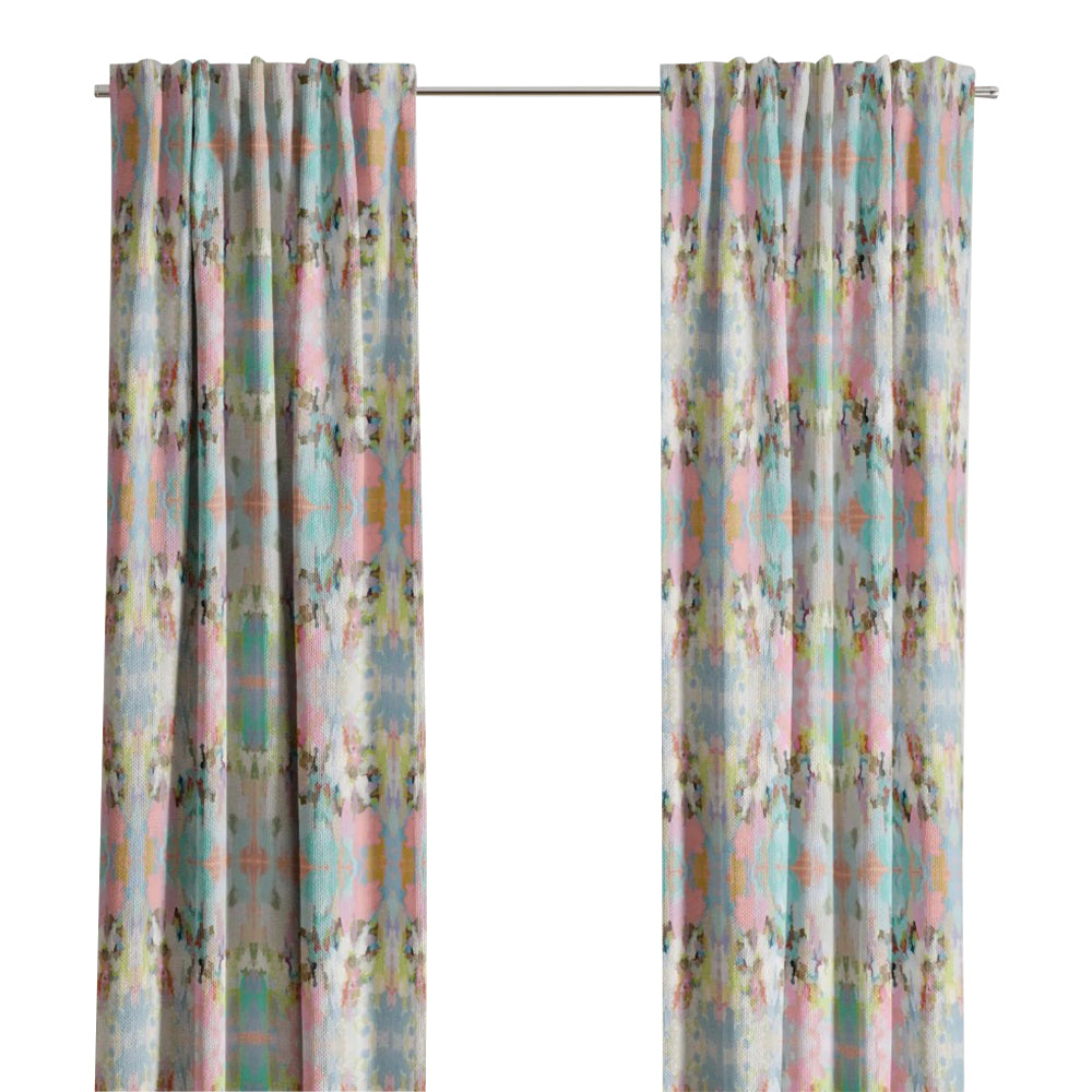 Brooks Avenue Curtain Panels by Laura Park Designs frame a bright window, adding joyful color to a lively scene.
