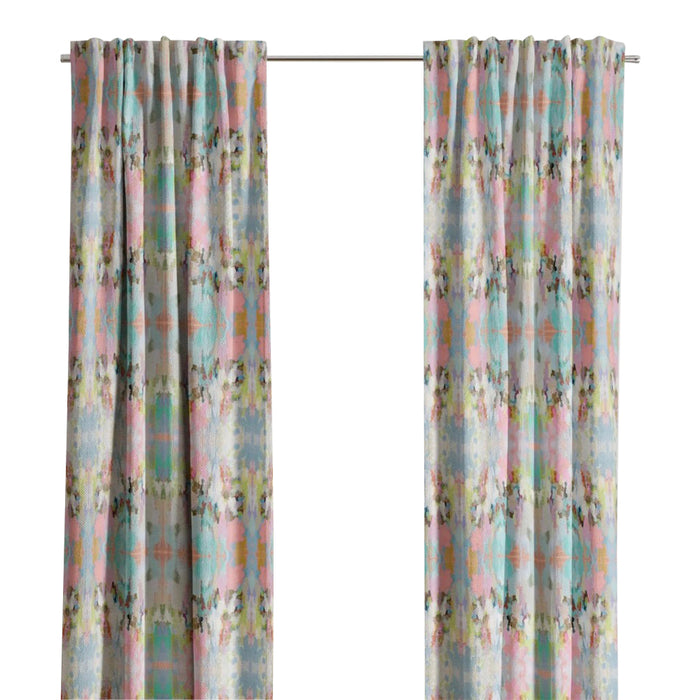 Brooks Avenue Curtain Panels by Laura Park Designs frame a bright window, adding joyful color to a lively scene.