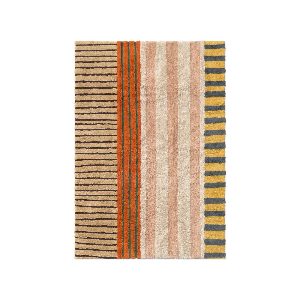 A textured shag rug featuring horizontal beige, orange and dark brown stripes, with a solid rust-orange border on the right side.