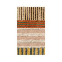 A rectangular shag area rug with a multicolor striped pattern, featuring beige, pink, orange, green, and yellow sections on a white background.