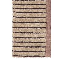 A close-up of a textured rug with horizontal beige and dark brown stripes and a solid brown side border, shown against a plain white background.