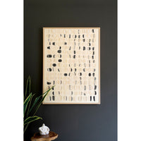 Kalalou's Framed Acrylic Abstract Stones Painting on a dark wall, with plant and sculpture on table—home decor delight.
