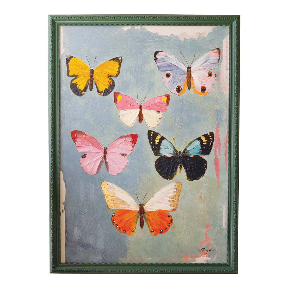 Framed artwork of colorful butterflies on a textured background