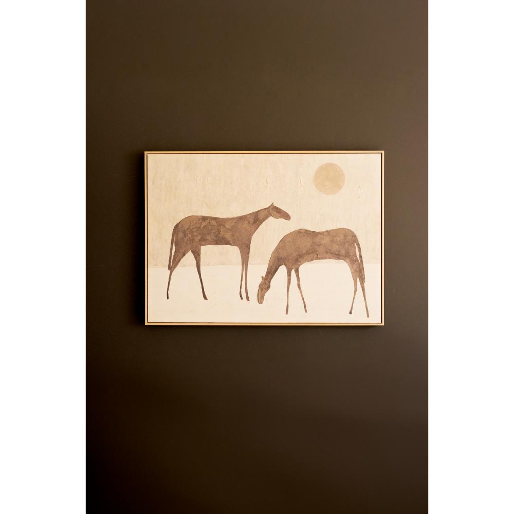 Framed artwork of two horses on a dark brown wall