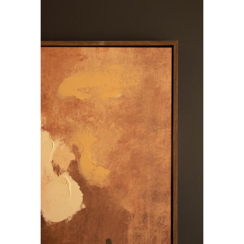 Corner view of wall art print featuring textured copper, gold, and cream paint strokes, set against a dark brown wall.