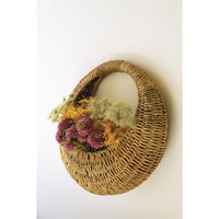 Kalalou's Woven Vine Wall Basket set of 2 adds charm to your decor with purple, white, and yellow flowers.