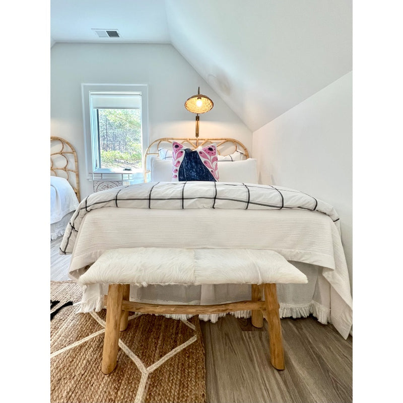 bedroom white sheets bench lamp throw pillow