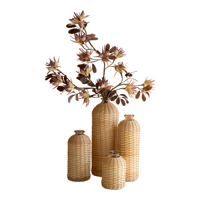 Set of woven vases with a floral arrangement on a white background