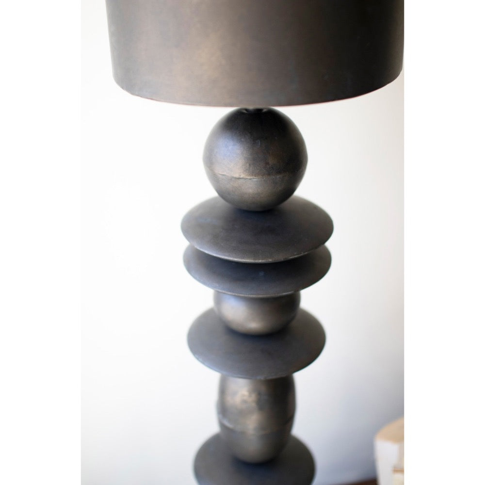 Decorative lamp with a unique base design on a white background