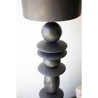 Decorative lamp with a unique base design on a white background