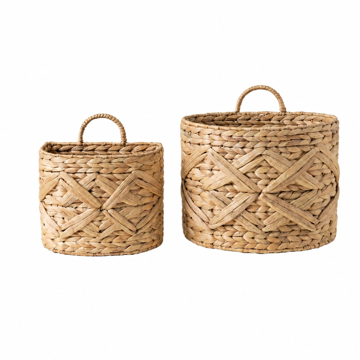 Two natural woven seagrass baskets with loop handles, shown on a plain white background. One basket is smaller and positioned to the left, and the larger basket is positioned to the right.