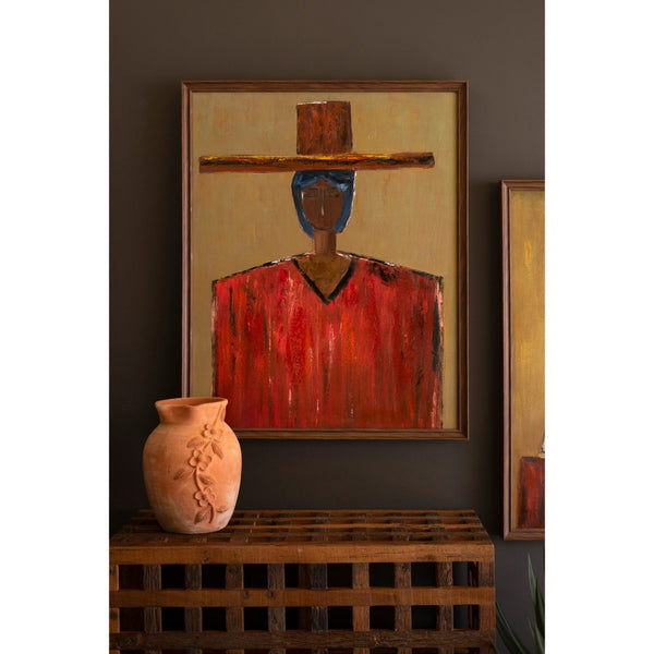 Abstract painting on a wall with a vase on a wooden shelf below.